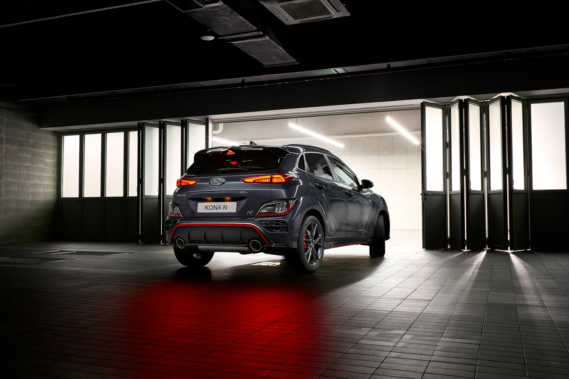 detailer applying ceramic coating to a Hyundai Kona Electric